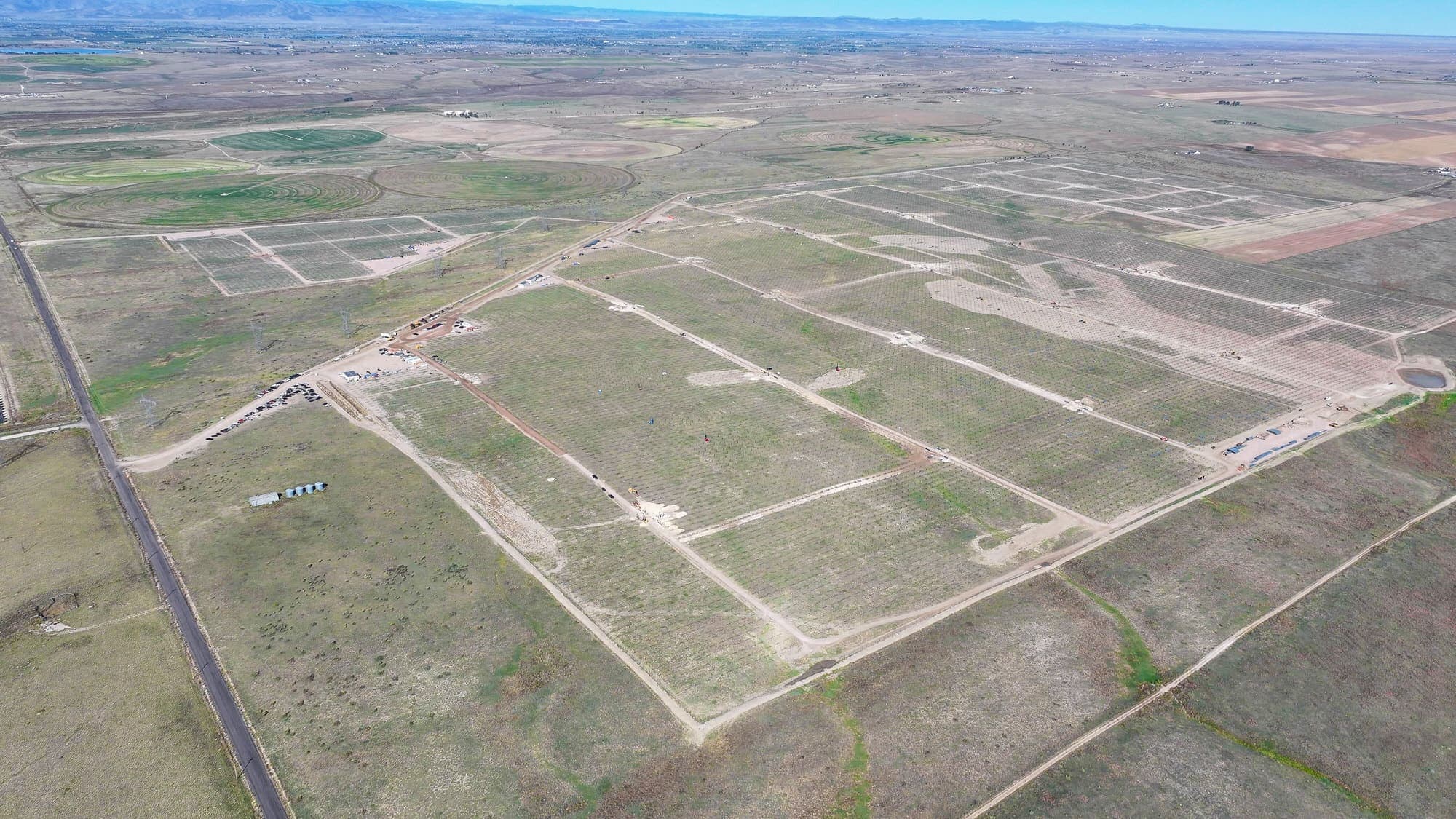 Aerial view of a large site laid out with graded access roads