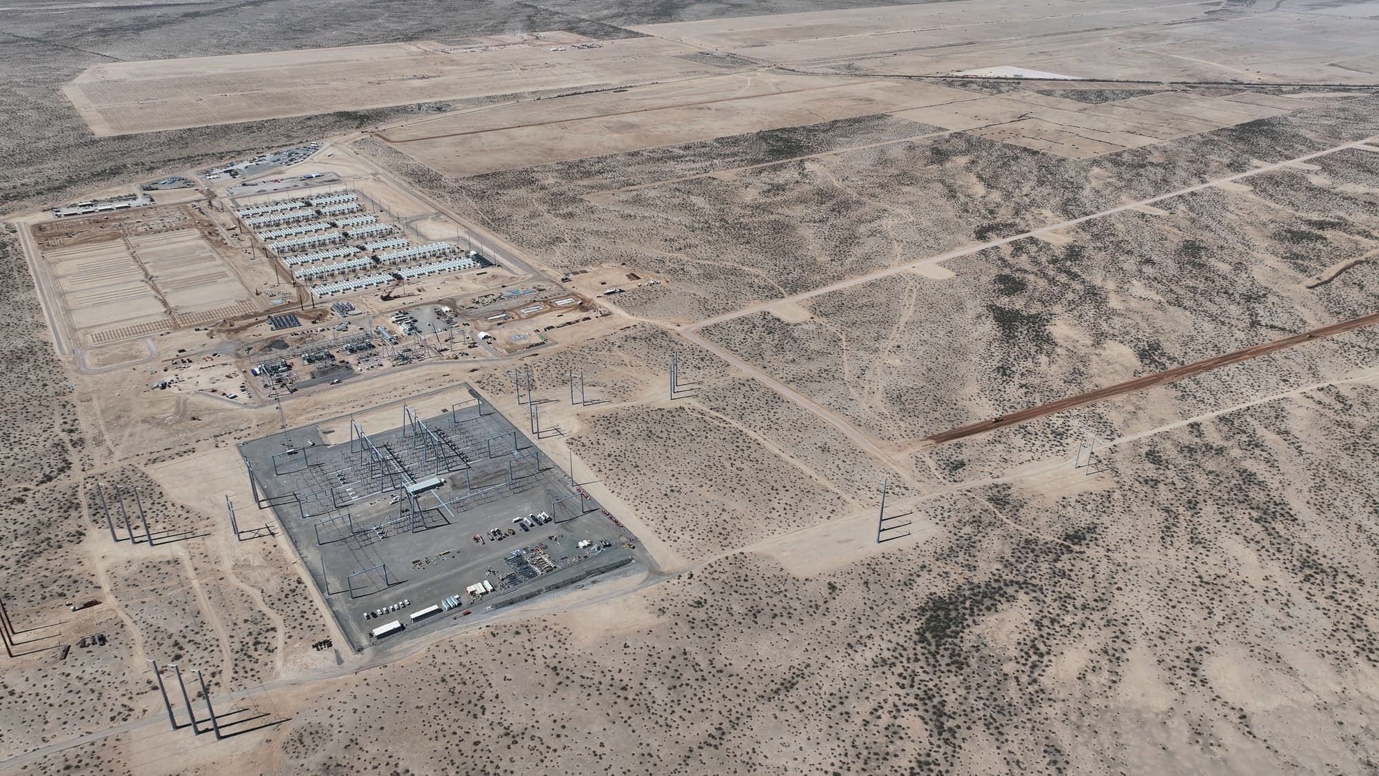 Aerial view of a substation and battery storage yard in the desert