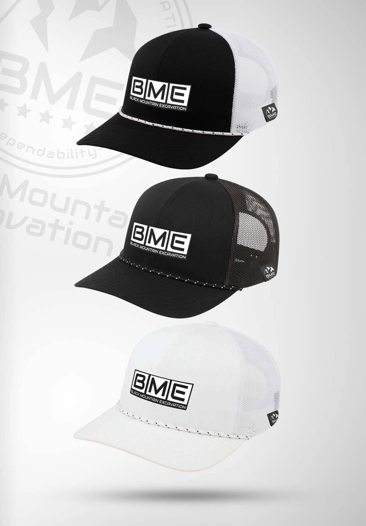 Three snapback hats in black and white with the embroidered BME block logo
