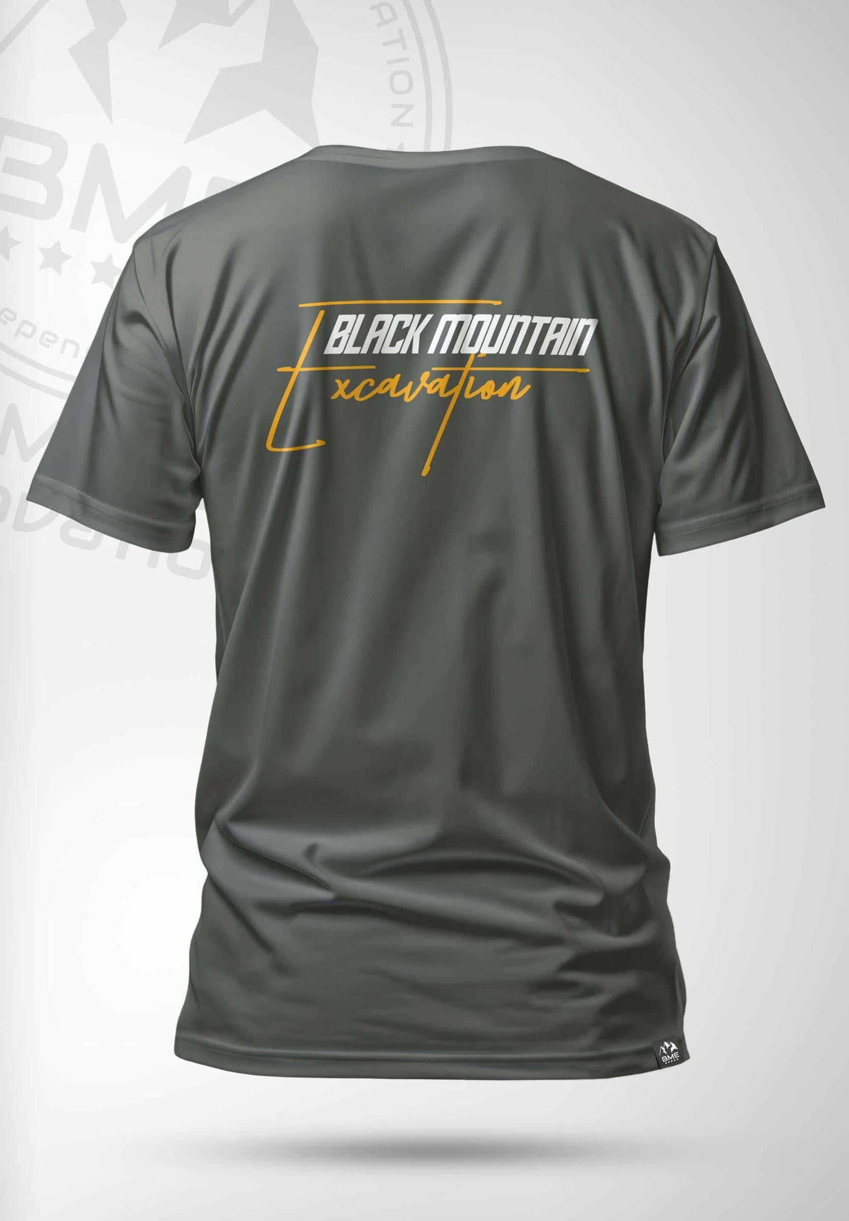 Olive t-shirt with a gold Black Mountain Excavation script logo